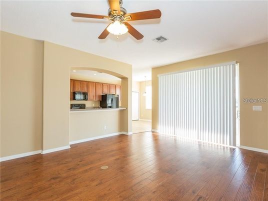 Empty room, Interior, Kitchen, Recessed Lighting, Stainless Steel Appliances, Wood Texture Flooring