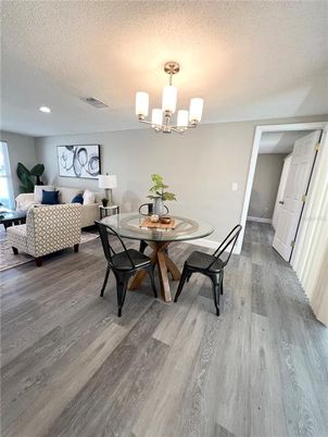 Bedroom, Chandelier, Dining room, Interior, Living room, Recessed Lighting, Wood Texture Flooring