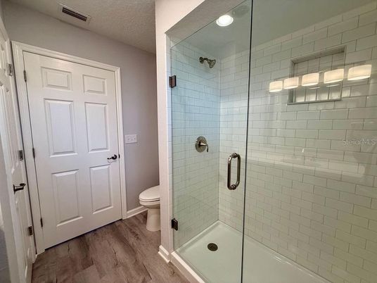 Bathroom, Glass Shower, Interior, Recessed Lighting, Wood Texture Flooring