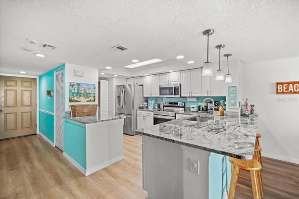 Interior, Kitchen, Pendant Lights, Recessed Lighting, Stainless Steel Appliances, Wood Texture Flooring