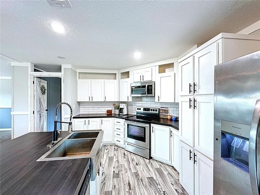 Interior, Kitchen, Recessed Lighting, Stainless Steel Appliances, Wood Texture Flooring