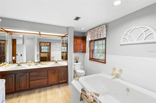 Bathroom, Dual Sink Vanities, Interior, Recessed Lighting, Wood Texture Flooring