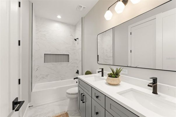 Bathroom, Dual Sink Vanities, Interior, Marble, Marble Walls, Recessed Lighting