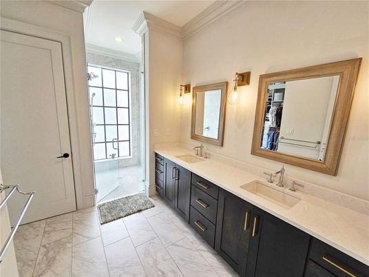 Bathroom, Dual Sink Vanities, Glass Shower, Interior, Marble, Recessed Lighting