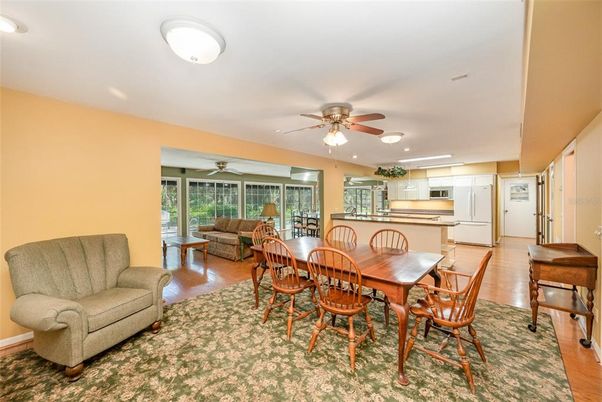 Dining room, Interior, Kitchen, Living room, Recessed Lighting, Stainless Steel Appliances, Wood Texture Flooring