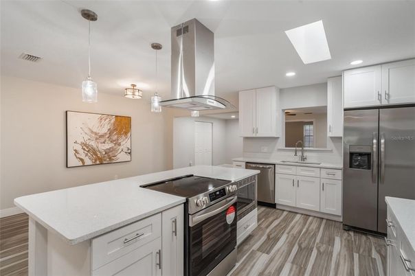 Interior, Kitchen, Pendant Lights, Recessed Lighting, Stainless Steel Appliances, Wood Texture Flooring