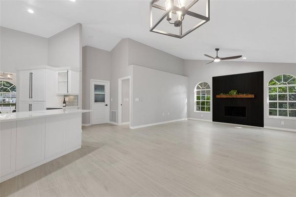 Empty room, Fireplace, Interior, Pendant Lights, Recessed Lighting, Wood Texture Flooring
