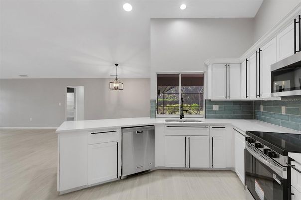 Interior, Kitchen, Pendant Lights, Recessed Lighting, Stainless Steel Appliances, Wood Texture Flooring