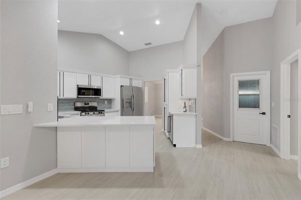 Interior, Kitchen, Recessed Lighting, Stainless Steel Appliances, Wood Texture Flooring