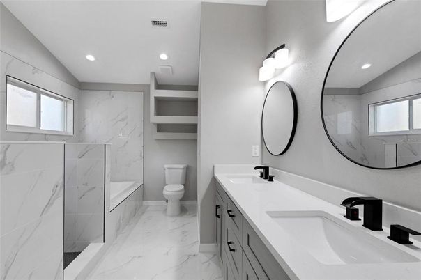 Bathroom, Dual Sink Vanities, Glass Shower, Interior, Marble, Marble Walls, Recessed Lighting