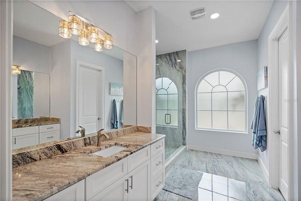 Bathroom, Dual Sink Vanities, Glass Shower, Interior, Marble, Recessed Lighting