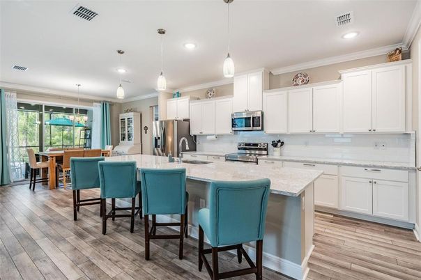 Dining room, Interior, Kitchen, Pendant Lights, Recessed Lighting, Stainless Steel Appliances, Wood Texture Flooring