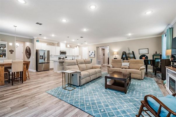 Dining room, Fireplace, Interior, Kitchen, Living room, Pendant Lights, Recessed Lighting, Stainless Steel Appliances, Wood Texture Flooring