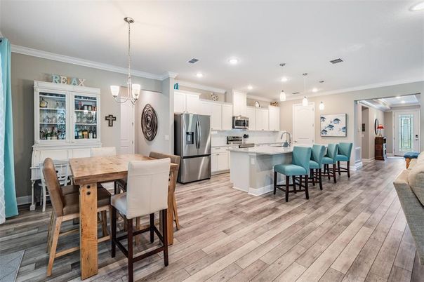 Dining room, Interior, Kitchen, Pendant Lights, Recessed Lighting, Stainless Steel Appliances, Wood Texture Flooring