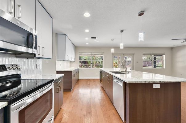 Interior, Kitchen, Pendant Lights, Recessed Lighting, Stainless Steel Appliances, Wood Texture Flooring