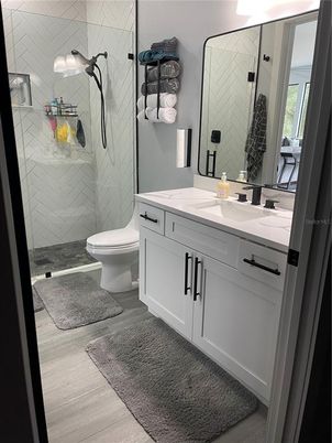 Bathroom, Dual Sink Vanities, Glass Shower, Interior, Wood Texture Flooring
