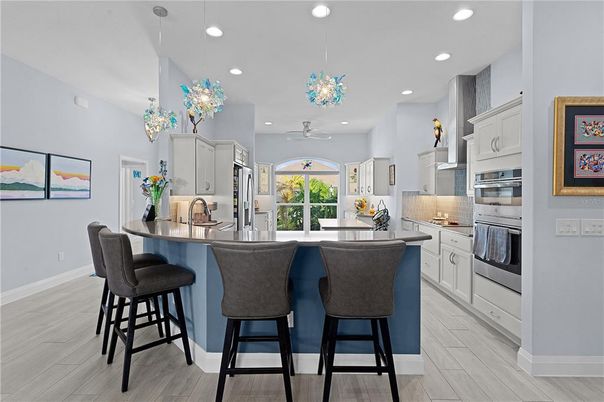 Chandelier, Interior, Kitchen, Pendant Lights, Recessed Lighting, Stainless Steel Appliances, Wood Texture Flooring