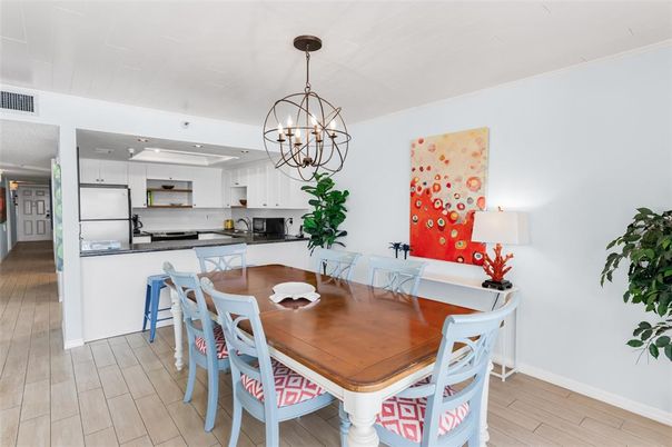 Chandelier, Dining room, Interior, Kitchen, Pendant Lights, Recessed Lighting, Stainless Steel Appliances, Wood Texture Flooring