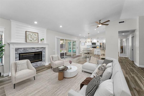 Dining room, Fireplace, Interior, Kitchen, Living room, Pendant Lights, Recessed Lighting, Stainless Steel Appliances, Wood Texture Flooring