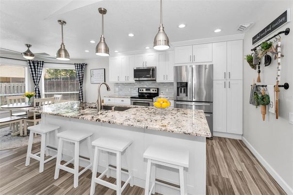 Dining room, Interior, Kitchen, Pendant Lights, Recessed Lighting, Stainless Steel Appliances, Wood Texture Flooring