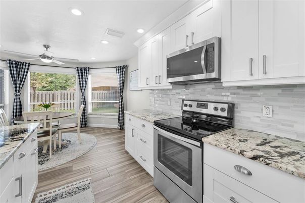 Dining room, Interior, Kitchen, Recessed Lighting, Stainless Steel Appliances, Wood Texture Flooring