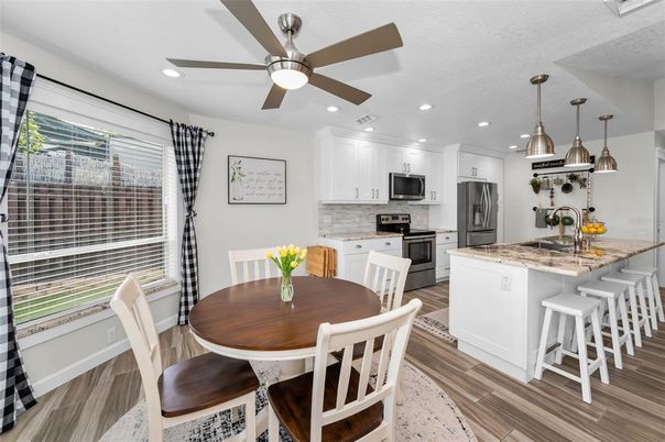 Dining room, Interior, Kitchen, Pendant Lights, Recessed Lighting, Stainless Steel Appliances, Wood Texture Flooring