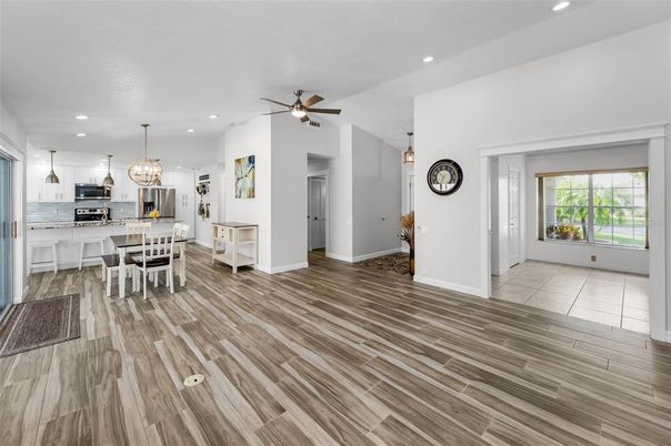 Chandelier, Dining room, Interior, Kitchen, Pendant Lights, Recessed Lighting, Stainless Steel Appliances, Wood Texture Flooring