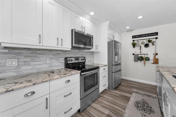 Interior, Kitchen, Recessed Lighting, Stainless Steel Appliances, Wood Texture Flooring
