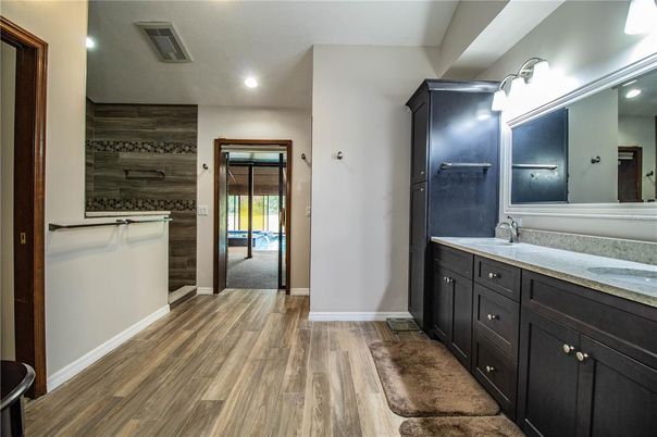 Bathroom, Dual Sink Vanities, Interior, Recessed Lighting, Wood Texture Flooring, Wooden Walls
