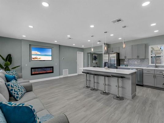 Fireplace, Interior, Kitchen, Living room, Pendant Lights, Recessed Lighting, Stainless Steel Appliances, Wood Texture Flooring