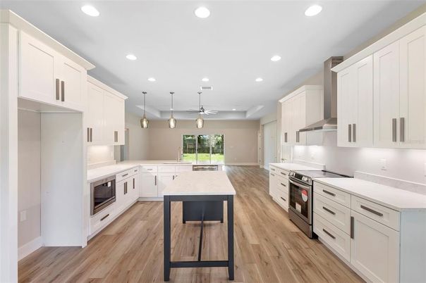 Interior, Kitchen, Pendant Lights, Recessed Lighting, Stainless Steel Appliances, Wood Texture Flooring