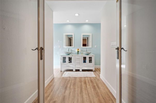 Bathroom, Dual Sink Vanities, Interior, Recessed Lighting, Wood Texture Flooring