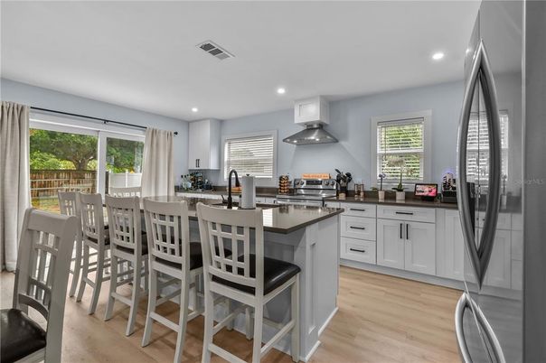 Dining room, Interior, Kitchen, Recessed Lighting, Stainless Steel Appliances, Wood Texture Flooring