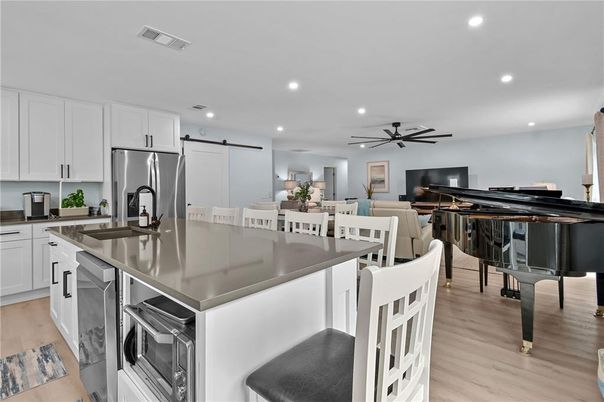 Dining room, Interior, Kitchen, Living room, Piano, Recessed Lighting, Wood Texture Flooring