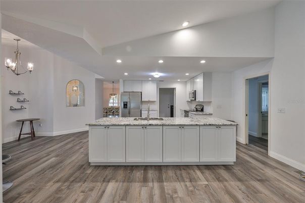 Interior, Kitchen, Pendant Lights, Recessed Lighting, Stainless Steel Appliances, Wood Texture Flooring