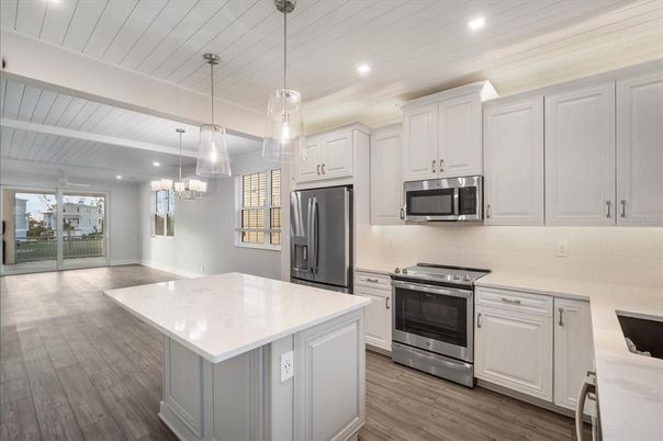 Chandelier, Interior, Kitchen, Pendant Lights, Recessed Lighting, Stainless Steel Appliances, Wood Texture Flooring