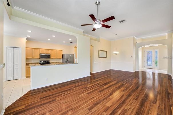 Empty room, Interior, Kitchen, Pendant Lights, Recessed Lighting, Stainless Steel Appliances, Wood Texture Flooring