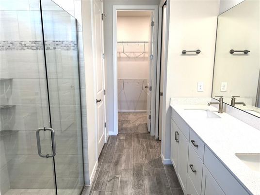 Bathroom, Dual Sink Vanities, Glass Shower, Interior, Walk-in Closets, Wood Texture Flooring