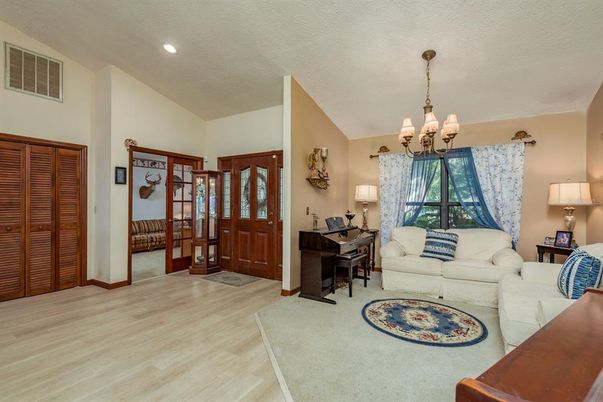 Chandelier, Interior, Living room, Piano, Recessed Lighting, Wood Texture Flooring
