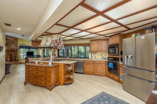 Interior, Kitchen, Recessed Lighting, Stainless Steel Appliances, Stone Walls, Wood Texture Flooring