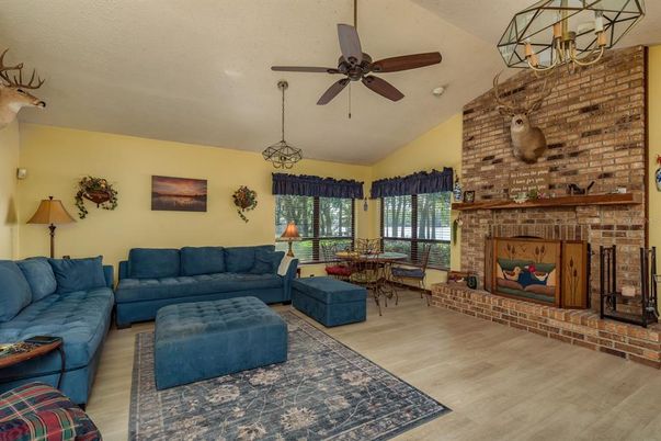 Dining room, Fireplace, Interior, Living room, Pendant Lights, Stone Walls, Wood Texture Flooring