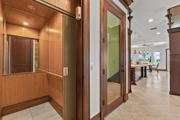 Chandelier, Dining room, Interior, Pendant Lights, Recessed Lighting, Water, Wooden Walls