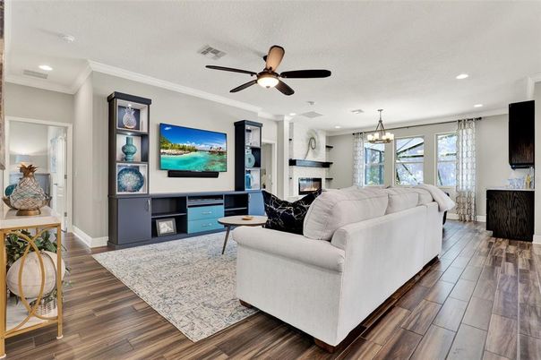 Chandelier, Fireplace, Interior, Living room, Pendant Lights, Recessed Lighting, Wood Texture Flooring
