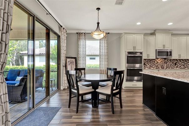 Dining room, Interior, Kitchen, Pendant Lights, Recessed Lighting, Stainless Steel Appliances, Wood Texture Flooring