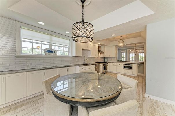 Dining room, Interior, Kitchen, Pendant Lights, Recessed Lighting, Stainless Steel Appliances, Stone Walls, Wood Texture Flooring