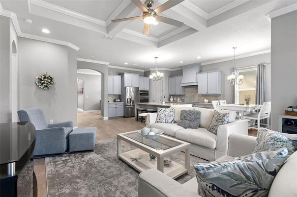 Chandelier, Dining room, Interior, Kitchen, Living room, Pendant Lights, Recessed Lighting, Stainless Steel Appliances, Wood Texture Flooring