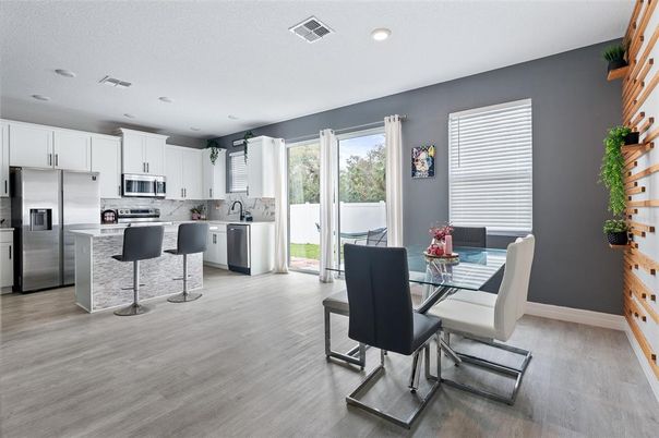 Dining room, Interior, Kitchen, Recessed Lighting, Stainless Steel Appliances, Wood Texture Flooring