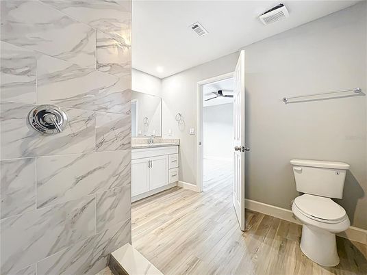 Bathroom, Interior, Marble Walls, Recessed Lighting, Wood Texture Flooring