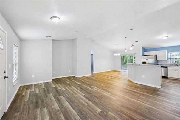 Empty room, Interior, Kitchen, Pendant Lights, Stainless Steel Appliances, Wood Texture Flooring