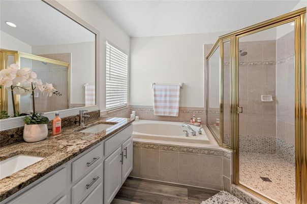 Bathroom, Dual Sink Vanities, Glass Shower, Interior, Recessed Lighting, Wood Texture Flooring